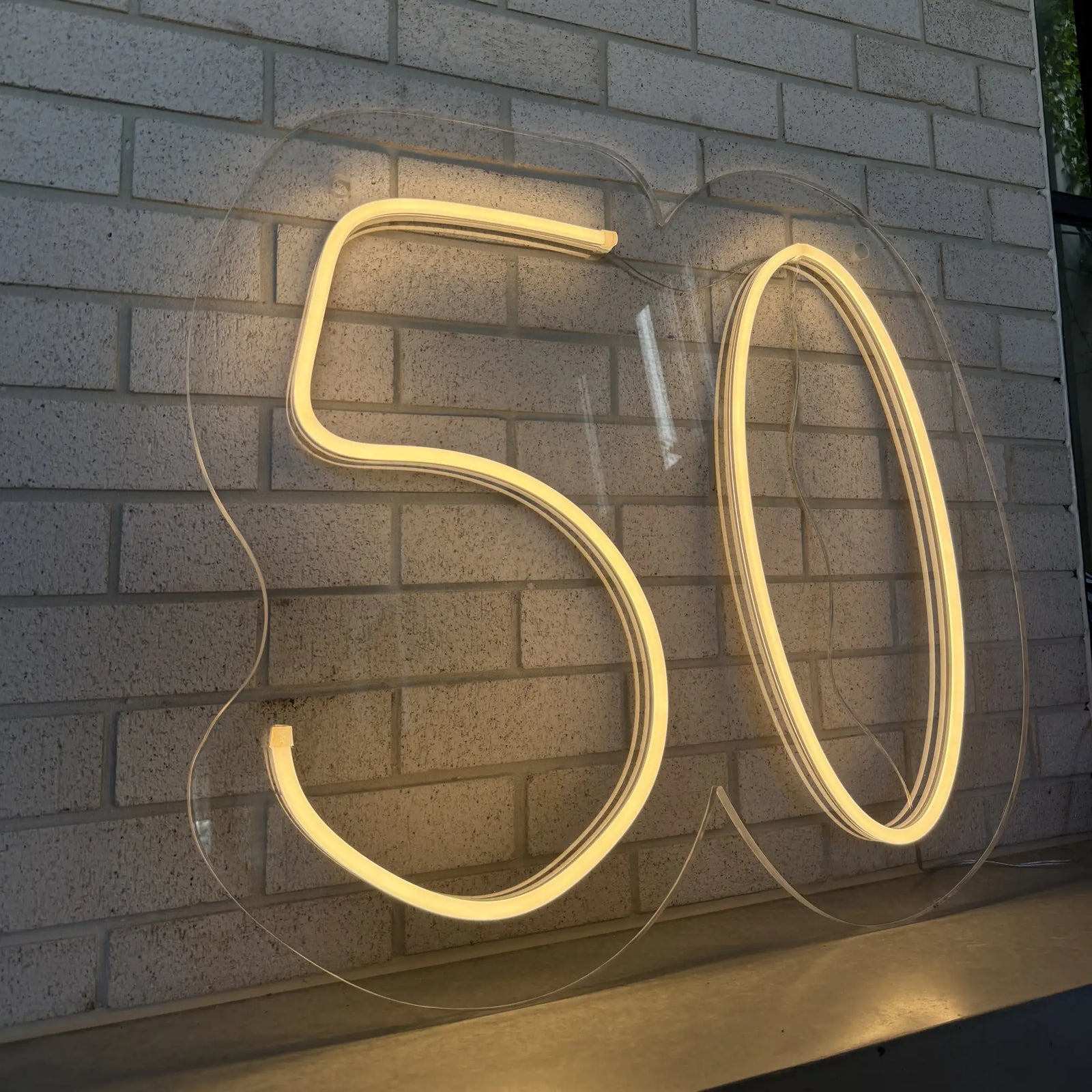 Celebrating 50 in Style: A Glowing Tribute with Custom Neon