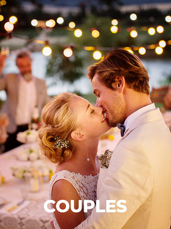 groom and bride kissing at wedding