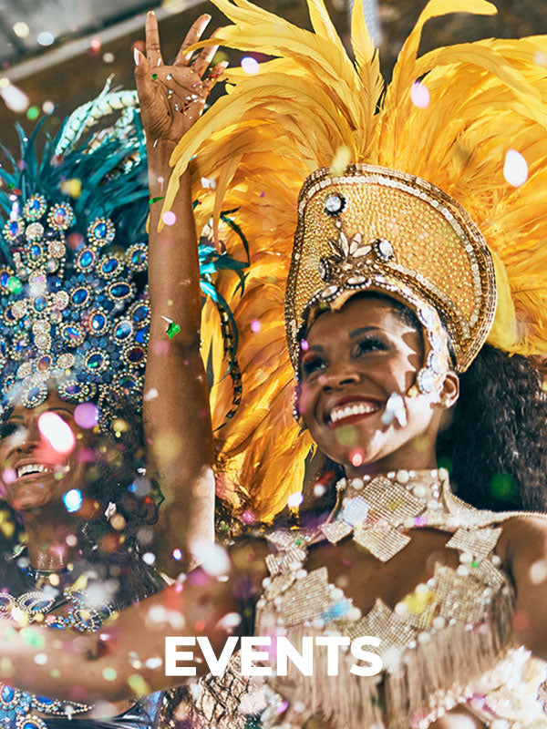 a group of women wearing bright festive clothes during an event